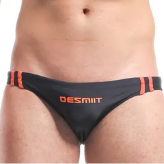 a sexy man in black Men’s Fast & Curious Skinny Swim Briefs - pridevoyageshop.com - gay men’s sexy swim briefs, trunks, board shorts, and bikinis