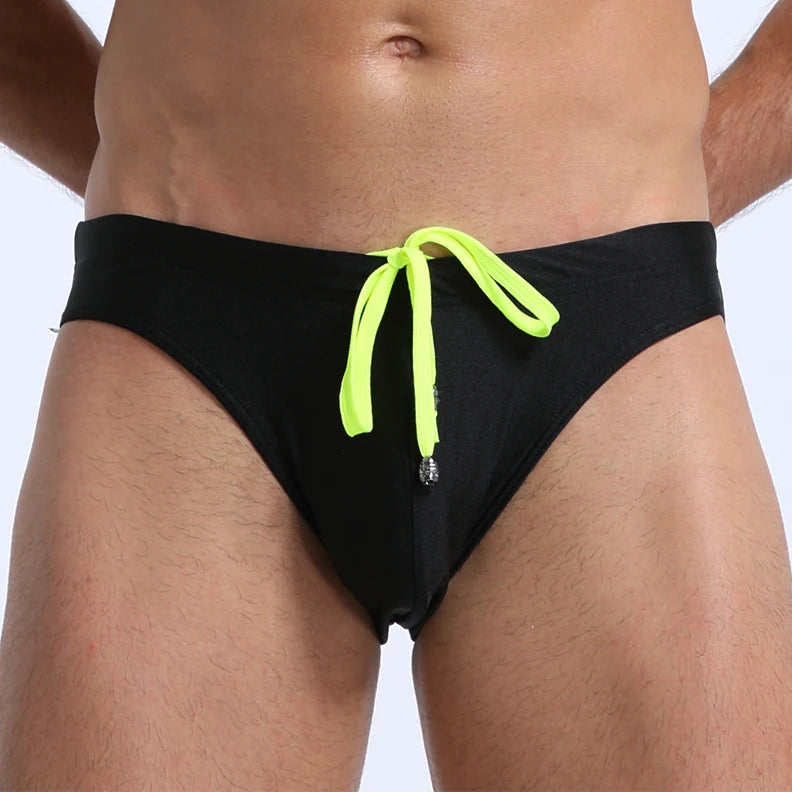 a sexy man in black Men's Killer Bulge Swim Brief - pridevoyageshop.com - gay men’s sexy swim briefs, trunks, board shorts, and bikinis
