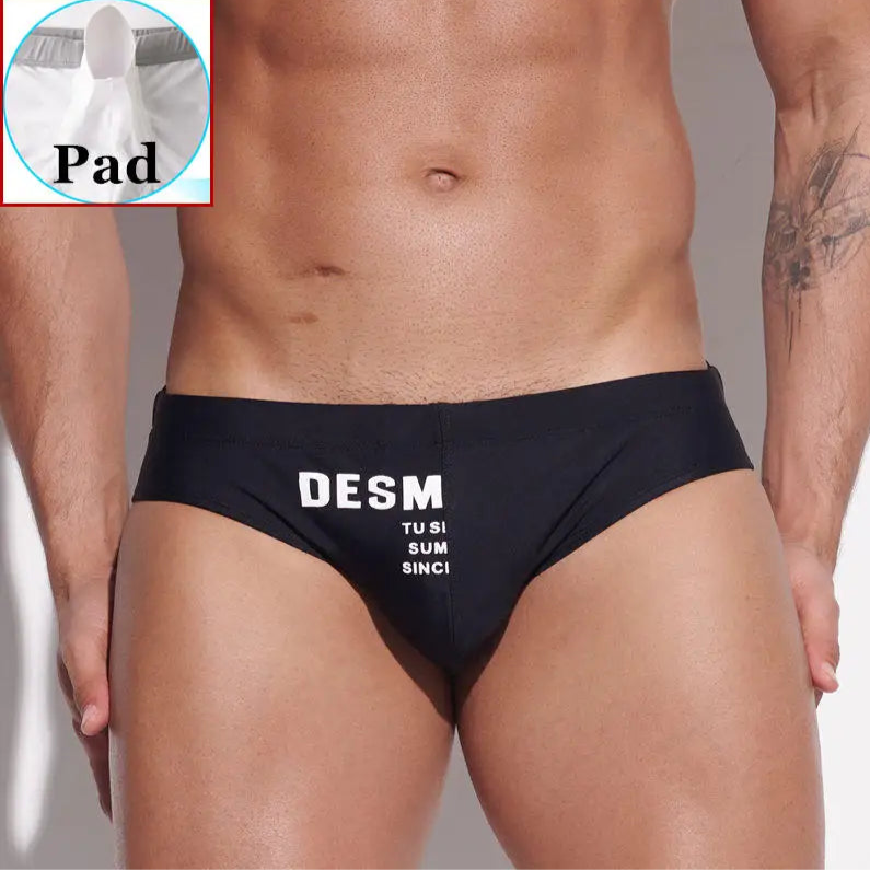 a sexy man in black Men’s MVP Meatpack Swim Briefs with pad - pridevoyageshop.com - gay men’s sexy swim briefs, trunks, board shorts, and bikinis