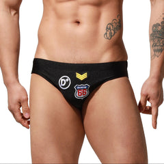 a sexy man in black Men’s Officer on Duty Low Rise Swim Briefs - pridevoyageshop.com - gay men’s sexy swim briefs, trunks, board shorts, and bikinis