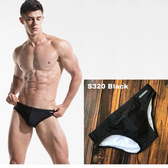 a sexy man in black Men’s Pool Plumper Padded Swim Briefs - pridevoyageshop.com - gay men’s sexy swim briefs, trunks, board shorts, and bikinis