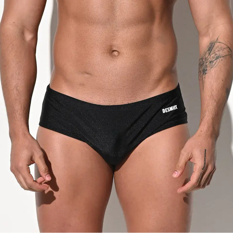 a sexy man in black Men’s Pouch Devil Low Rise Swim Briefs - pridevoyageshop.com - gay men’s sexy swim briefs, trunks, board shorts, and bikinis