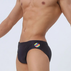 a sexy man in black Men’s Pride Rainbow Print Sexy Swim Briefs - pridevoyageshop.com - gay men’s sexy swim briefs, trunks, board shorts, and bikinis