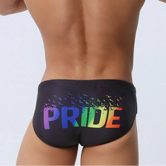 a sexy man in black Men’s Pride Rainbow Print Sexy Swim Briefs - pridevoyageshop.com - gay men’s sexy swim briefs, trunks, board shorts, and bikinis