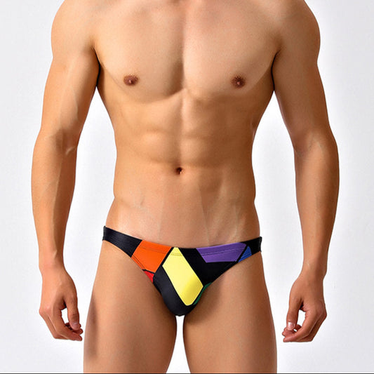 a sexy man in black Men’s Queer Grid Rainbow Pride Swim Briefs - pridevoyageshop.com - gay men’s sexy swim briefs, trunks, board shorts, and bikinis