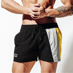 a sexy man in black Men’s Signal Swim Beach Board Shorts – pridevoyageshop.com – gay men’s sexy swim briefs, trunks, board shorts, and bikinis
