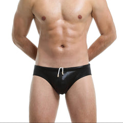 a sexy man in black Men’s Slay the Shine Shiny Swim Briefs - pridevoyageshop.com - gay men’s sexy swim briefs, trunks, board shorts, and bikinis