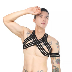 a sexy man in black Men’s The Lewk Chest Harness Set – pridevoyageshop.com – gay men’s harness, lingerie and fetish wear