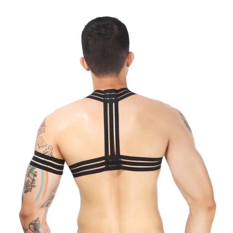 a sexy man in black Men’s The Lewk Chest Harness Set – pridevoyageshop.com – gay men’s harness, lingerie and fetish wear