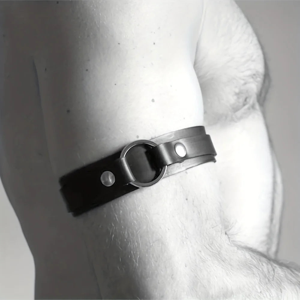 a sexy man in black Men’s The Punctuation Straps Armbands – pridevoyageshop.com – gay men’s harness, lingerie and fetish wear