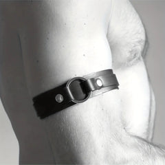 a sexy man in black Men’s The Punctuation Straps Armbands – pridevoyageshop.com – gay men’s harness, lingerie and fetish wear