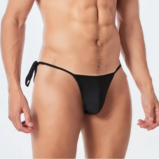 a sexy man in black Men’s Werk It Tie-Up Swim Bikini Thong – pridevoyageshop.com – gay men’s sexy swim briefs, trunks, board shorts, and bikinis