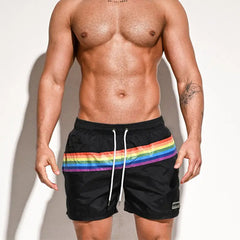	a sexy man in black Men’s Werk the Rainbow Volley Pride Board Shorts – pridevoyageshop.com – gay men’s sexy swim briefs, trunks, board shorts, and bikinis
