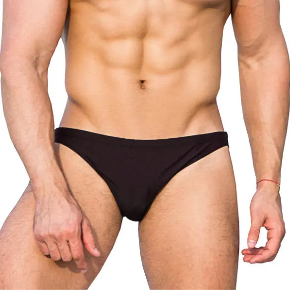 a sexy man in black Men’s Wet Dream Bikini Swim Briefs - pridevoyageshop.com - gay men’s sexy swim briefs, trunks, board shorts, and bikinis