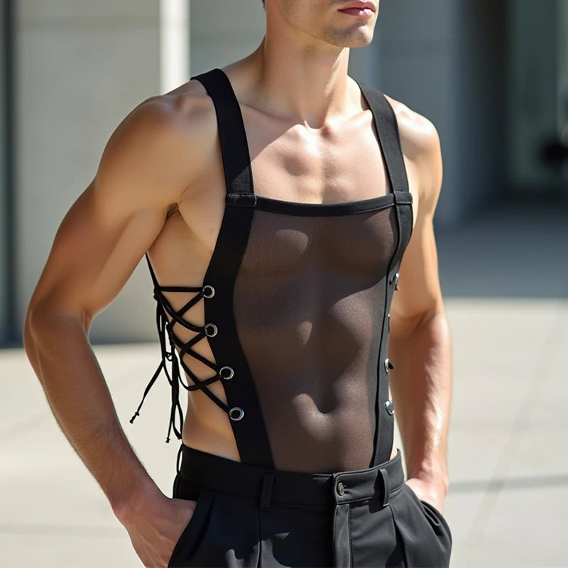 a sexy man in black Side Piece Lace-Up Mesh Bodysuit with sheer mesh torso and lace-up sides, hugging his body and showing off defined chest and waist – pridevoyageshop.com – gay men’s harness, lingerie and fetish wear