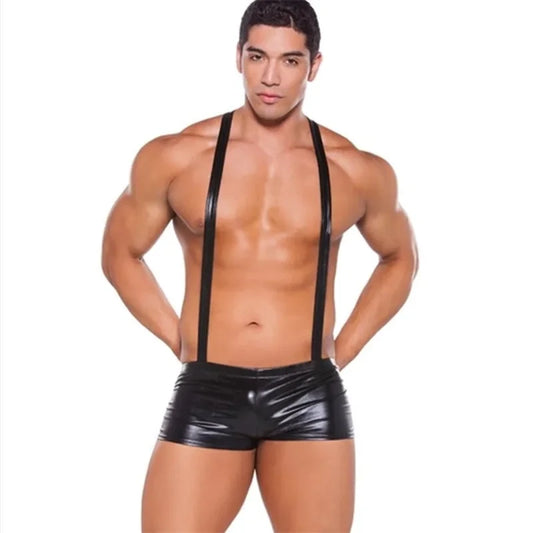 a sexy man in black The Handles Wet-Look Suspender Singlet – pridevoyageshop.com – gay men’s harness, lingerie and fetish wear
