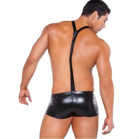 a sexy man in black The Handles Wet-Look Suspender Singlet – pridevoyageshop.com – gay men’s harness, lingerie and fetish wear