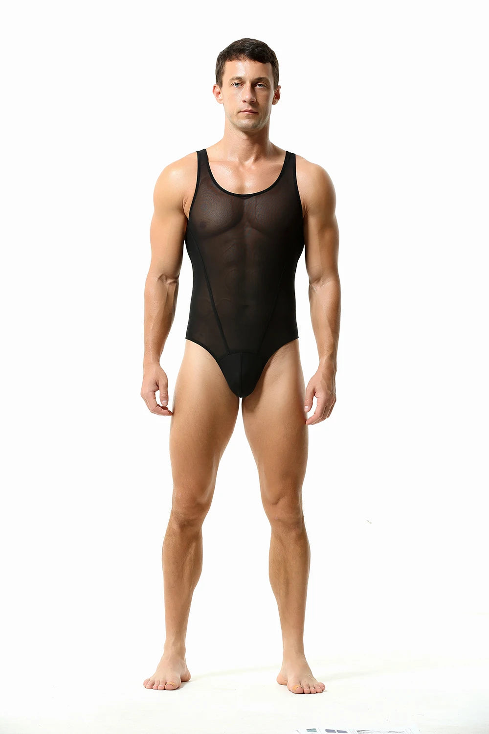 a sexy man in black The Preview Sheer Bodysuit – pridevoyageshop.com – gay men’s harness, lingerie and fetish wear