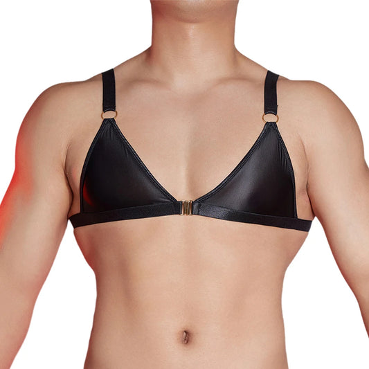 a sexy man in black faux-leather bralette with front clasp, shiny finish hugging chest and showing pecs and straps – pridevoyageshop.com – gay men’s harness, lingerie and fetish wear