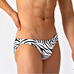 a sexy man in black striped Men’s Wild Streak Swim Briefs - pridevoyageshop.com - gay men’s sexy swim briefs, trunks, board shorts, and bikinis