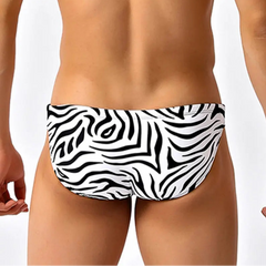 a sexy man in black striped Men’s Wild Streak Swim Briefs - pridevoyageshop.com - gay men’s sexy swim briefs, trunks, board shorts, and bikinis