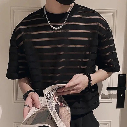 a sexy man in black striped The Venetian Sheer Stripe Tee - pridevoyageshop.com - gay men’s harness, lingerie and fetish wear