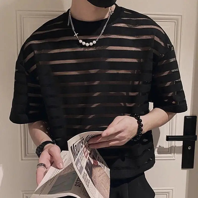 a sexy man in black striped The Venetian Sheer Stripe Tee - pridevoyageshop.com - gay men’s harness, lingerie and fetish wear