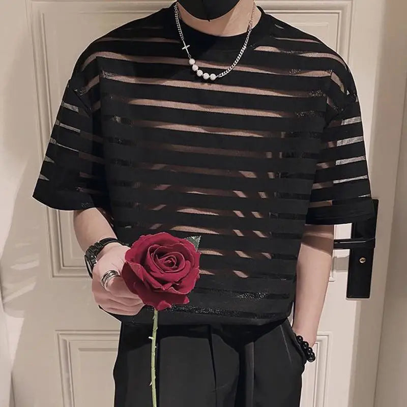 a sexy man in black striped The Venetian Sheer Stripe Tee - pridevoyageshop.com - gay men’s harness, lingerie and fetish wear
