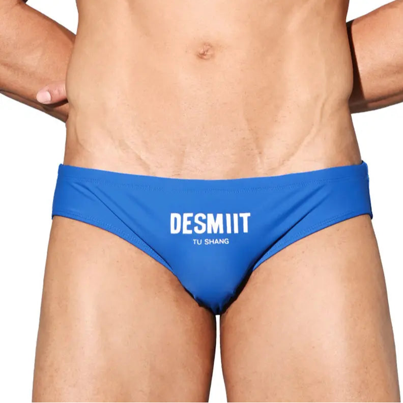 a sexy man in blue Desmiit Men’s Brunch-Ready Bikini Swim Briefs - pridevoyageshop.com - gay men’s sexy swim briefs, trunks, board shorts, and bikinis