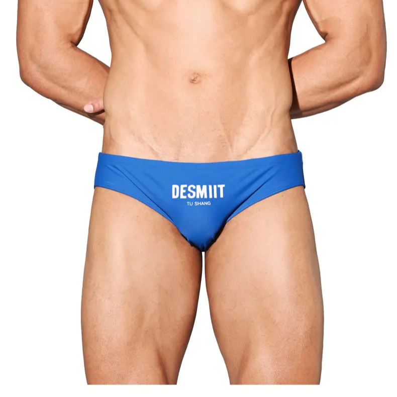 a sexy man in blue Desmiit Men’s Brunch-Ready Bikini Swim Briefs - pridevoyageshop.com - gay men’s sexy swim briefs, trunks, board shorts, and bikinis