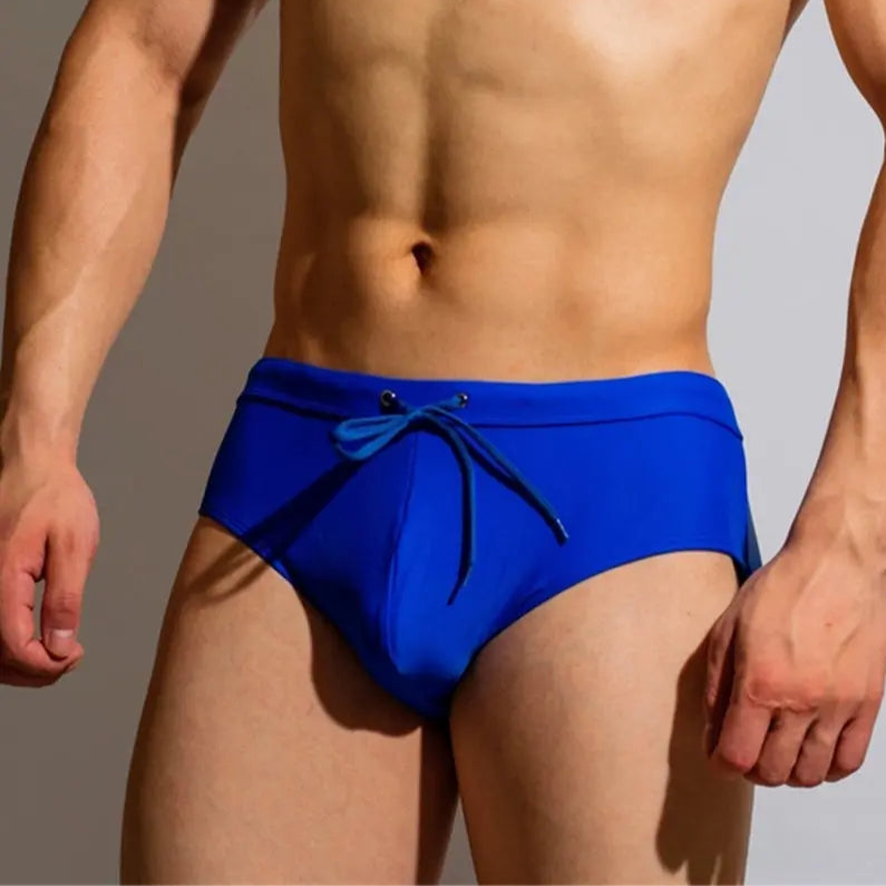 a sexy man in blue Men’s Backdoor Access Zipper Swim Briefs - pridevoyageshop.com - gay men’s sexy swim briefs, trunks, board shorts, and bikinis