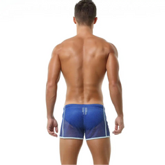 a sexy man in blue Men’s Beacon Cruise Mesh Shorts – pridevoyageshop.com – gay men’s sexy swim briefs, trunks, board shorts, and bikinis