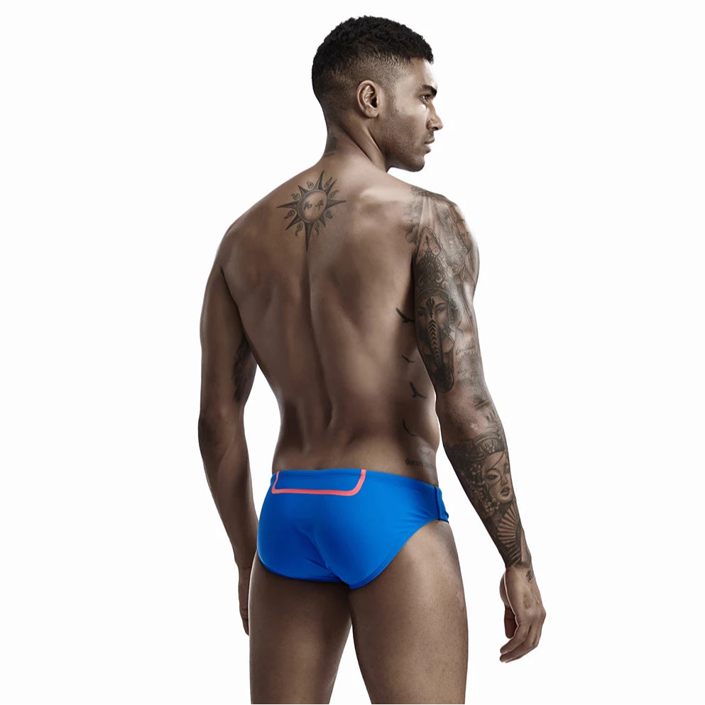 a sexy man in blue Men’s Bold Bulge Wave Swim Briefs - pridevoyageshop.com - gay men’s sexy swim briefs, trunks, board shorts, and bikinis