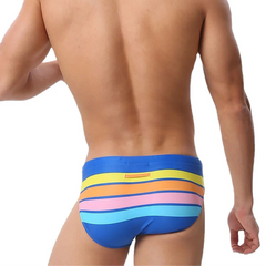 a sexy man in blue Men’s Bottom Line Stripe Swim Briefs - pridevoyageshop.com - gay men’s sexy swim briefs, trunks, board shorts, and bikinis