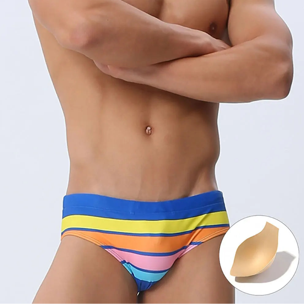 a sexy man in blue Men’s Bottom Line Stripe Swim Briefs with pad - pridevoyageshop.com - gay men’s sexy swim briefs, trunks, board shorts, and bikinis