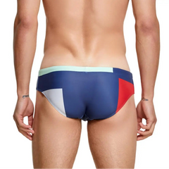 a sexy man in blue Men’s Colorblock Bait Swim Briefs - pridevoyageshop.com - gay men’s sexy swim briefs, trunks, board shorts, and bikinis