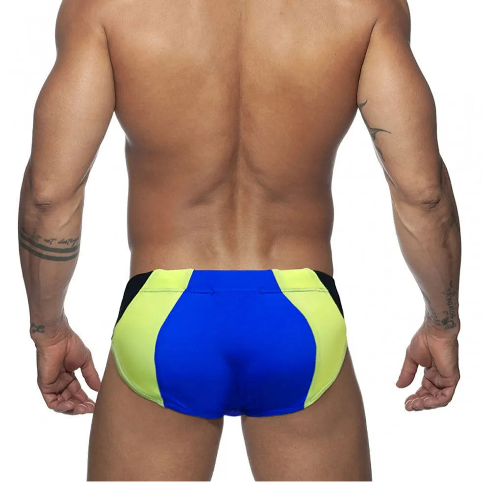 a sexy man in blue Men’s Colorblock Bulge-Boost Swim Briefs - pridevoyageshop.com - gay men’s sexy swim briefs, trunks, board shorts, and bikinis