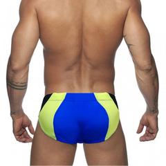 a sexy man in blue Men’s Colorblock Bulge-Boost Swim Briefs - pridevoyageshop.com - gay men’s sexy swim briefs, trunks, board shorts, and bikinis