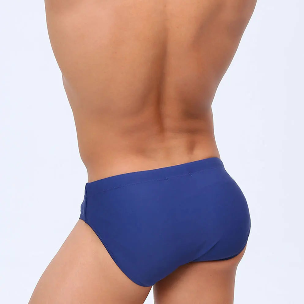 a sexy man in blue Men’s Double Zipper Pouch Swim Briefs - pridevoyageshop.com - gay men’s sexy swim briefs, trunks, board shorts, and bikinis