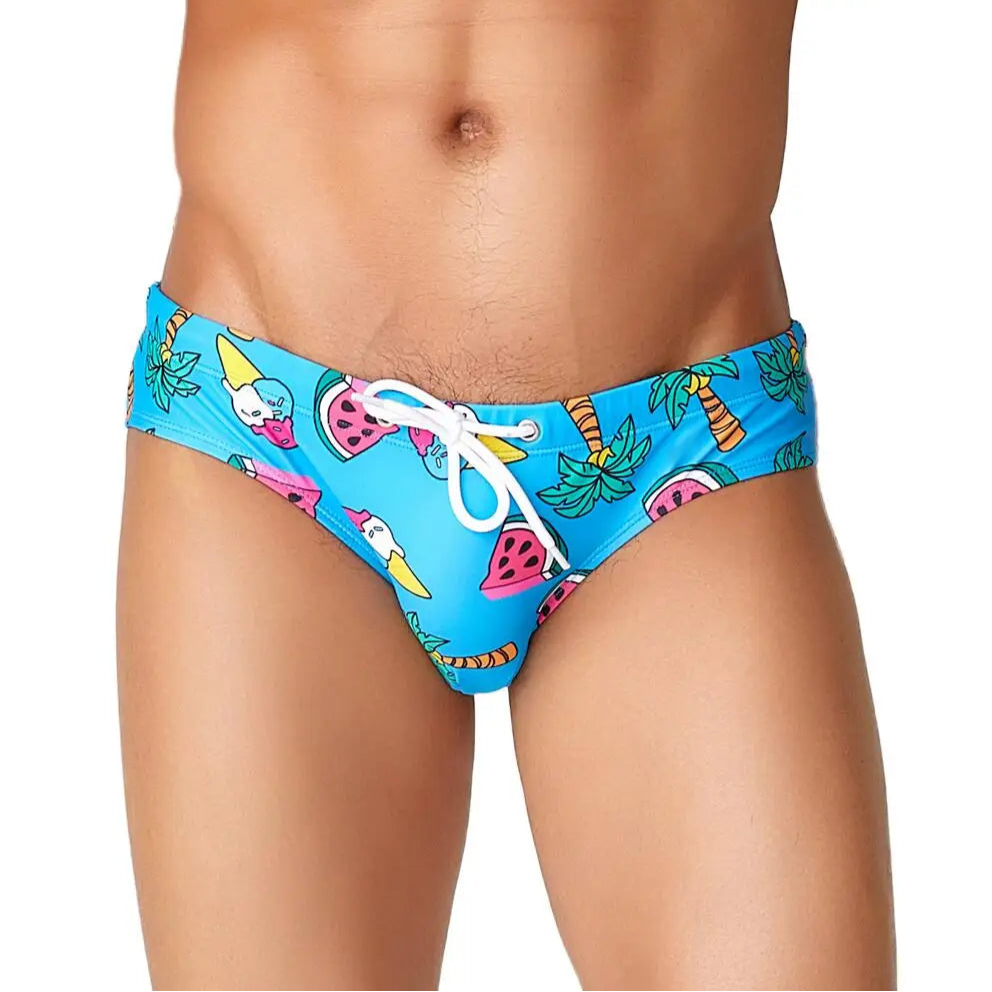 a sexy man in blue Men’s Juicy Thirst Summer Swim Briefs - pridevoyageshop.com - gay men’s sexy swim briefs, trunks, board shorts, and bikinis