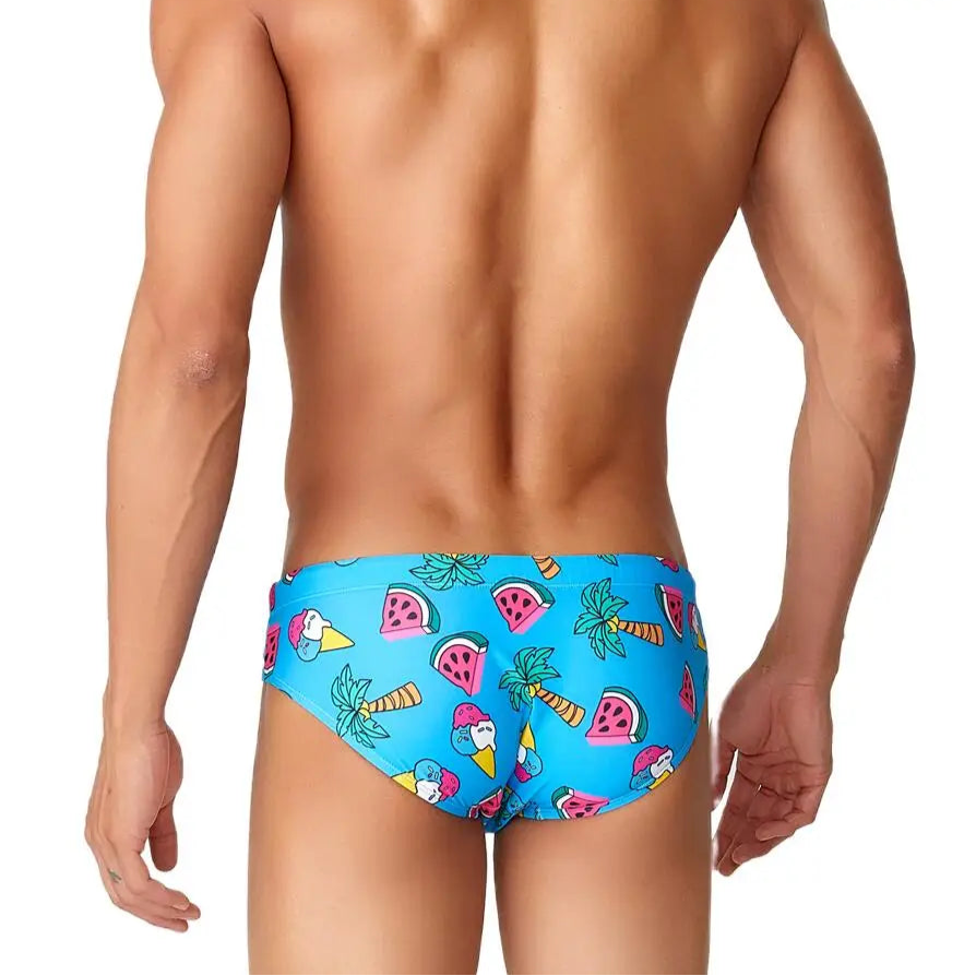 a sexy man in blue Men’s Juicy Thirst Summer Swim Briefs - pridevoyageshop.com - gay men’s sexy swim briefs, trunks, board shorts, and bikinis