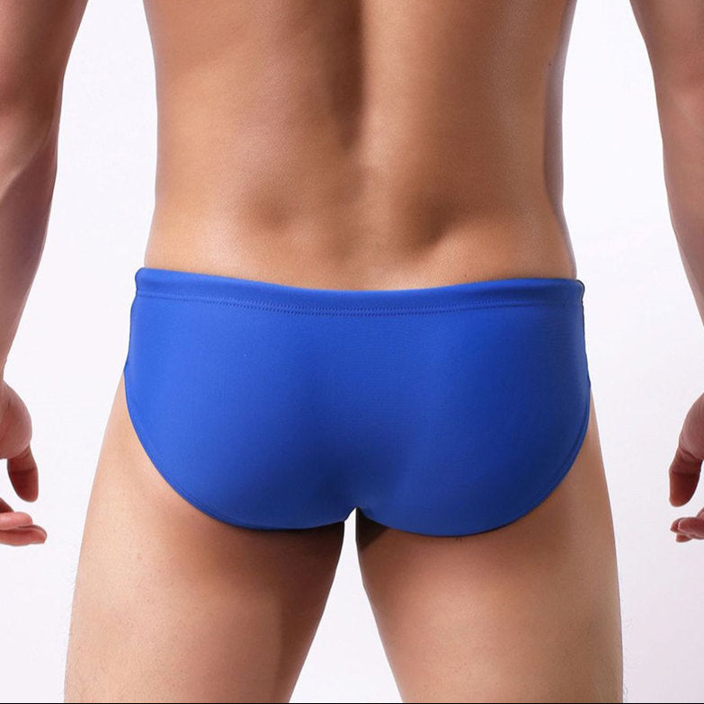 a sexy man in blue Men’s Package Patrol Swim Briefs - pridevoyageshop.com - gay men’s sexy swim briefs, trunks, board shorts, and bikinis