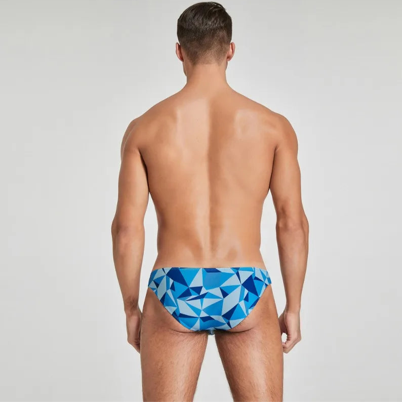 a sexy man in blue Men’s Prism Tease Swim Briefs - pridevoyageshop.com - gay men’s sexy swim briefs, trunks, board shorts, and bikinis