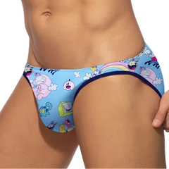 a sexy man in blue Men’s Toon Riot Swim Bikini Briefs – pridevoyageshop.com – gay men’s sexy swim briefs, trunks, board shorts, and bikinis