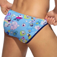 a sexy man in blue Men’s Toon Riot Swim Bikini Briefs – pridevoyageshop.com – gay men’s sexy swim briefs, trunks, board shorts, and bikinis