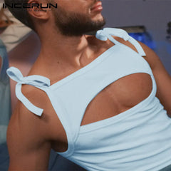 a sexy man in blue PecaBoo Bow Crop – pridevoyageshopcom – gay mens clubwear mesh tanks crop tops fashion tops partywear activewear