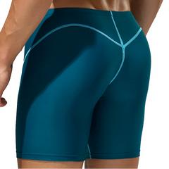 a sexy man in blue green Men’s Code Lock Speed Vortex Compression Swim Shorts – pridevoyageshop.com – gay men’s sexy swim briefs, trunks, board shorts, and bikinis
