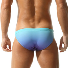 a sexy man in blue purple Seobean Men’s Poolside Craving Swim Briefs - pridevoyageshop.com - gay men’s sexy swim briefs, trunks, board shorts, and bikinis