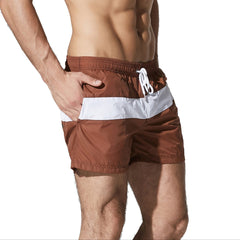 a sexy man in coffee Men’s Block Party Volley Swim Short – pridevoyageshop.com – gay men’s sexy swim briefs, trunks, board shorts, and bikinis