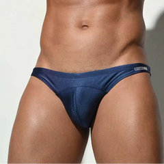 a sexy man in dark blue Desmiit Men’s Heatseeker Micro Swim Briefs - pridevoyageshop.com - gay men’s sexy swim briefs, trunks, board shorts, and bikinis